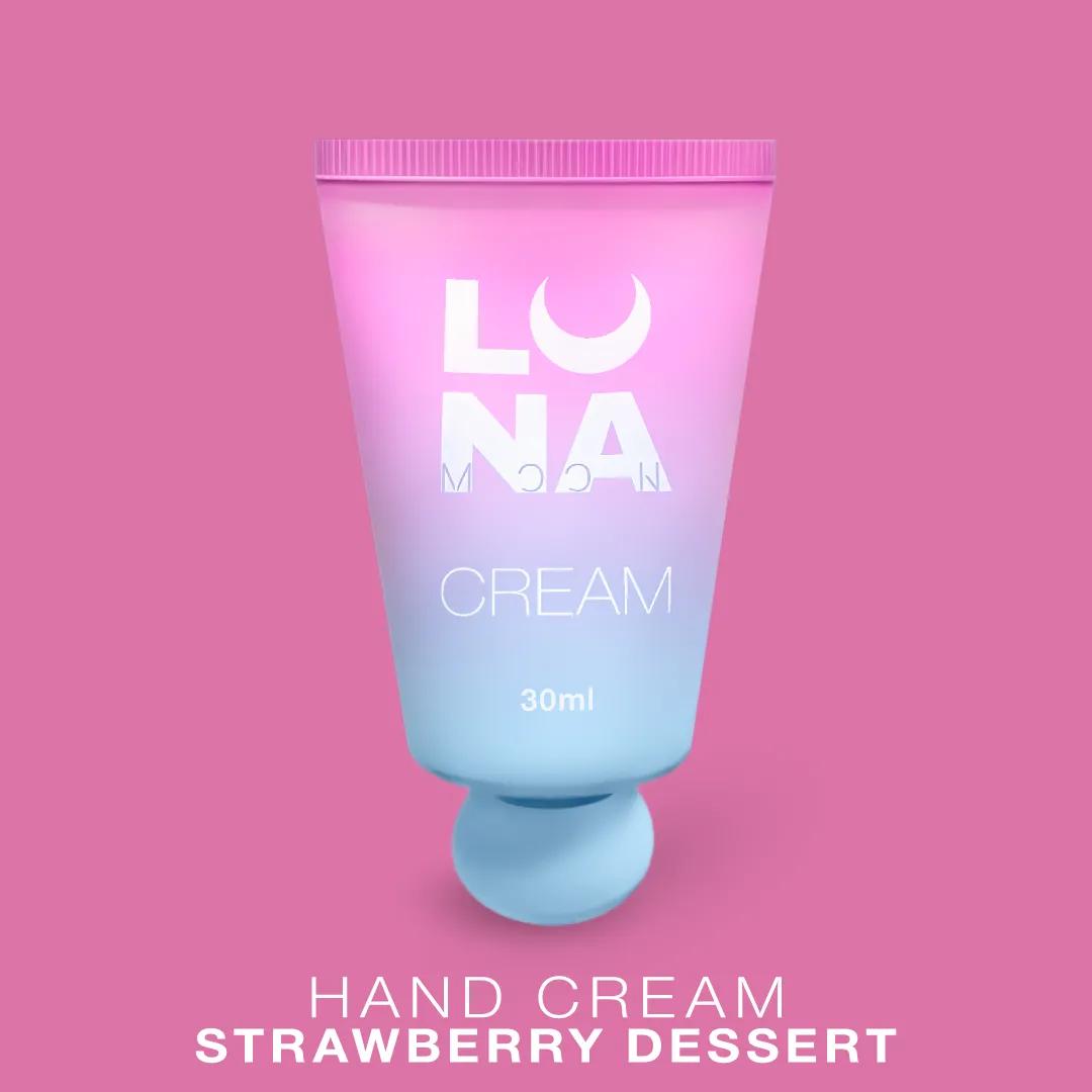 Crème pour les mains LUNAmoon Strawberry Dessert à la fraise et à la crème, hydratante, nourrissante et enrichie en fines particules scintillantes.